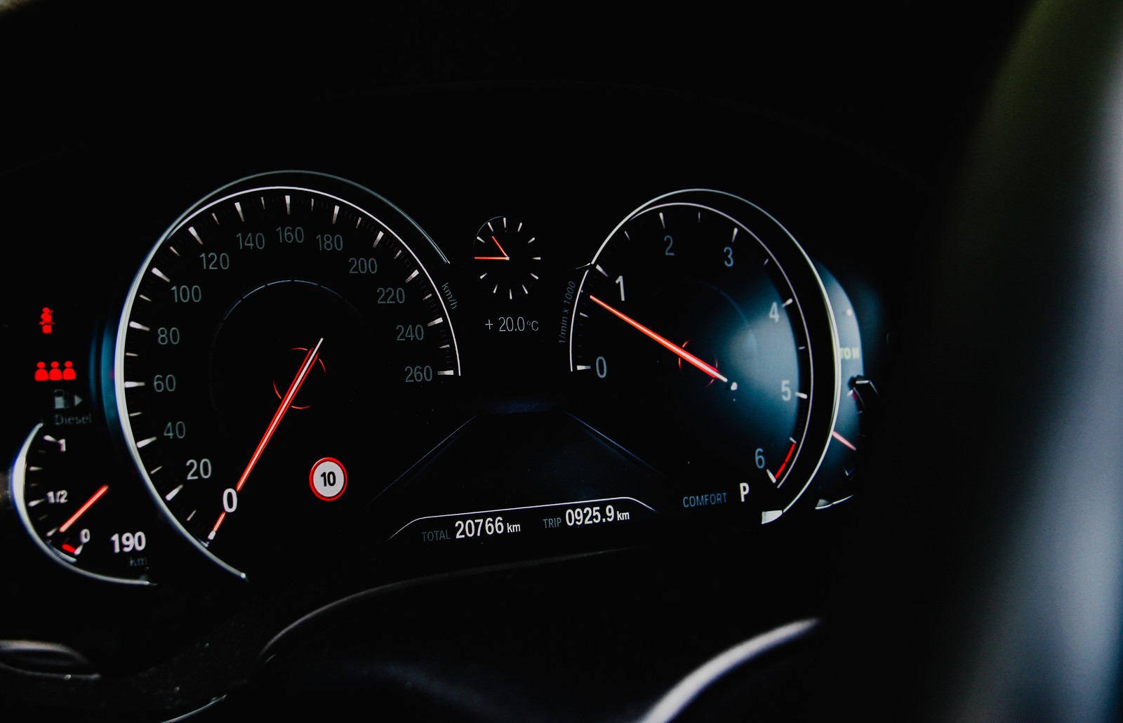 A close up of a car dashboard with a speedometer and gauges (car, speedometer, auto part, gauge, tachometer)