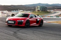 Audi R8 Coupé rojo: Un coche deportivo V10 de alto rendimiento en la pista