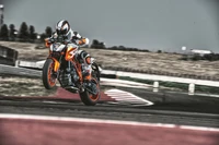 KTM Duke in Action at the Race Track: Embracing the Thrill of Supermoto Racing