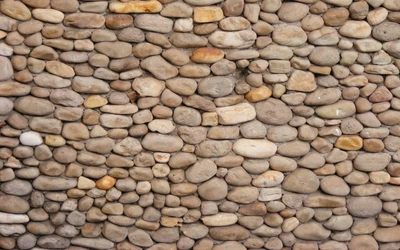 Pared de piedra texturizada con guijarros y rocas