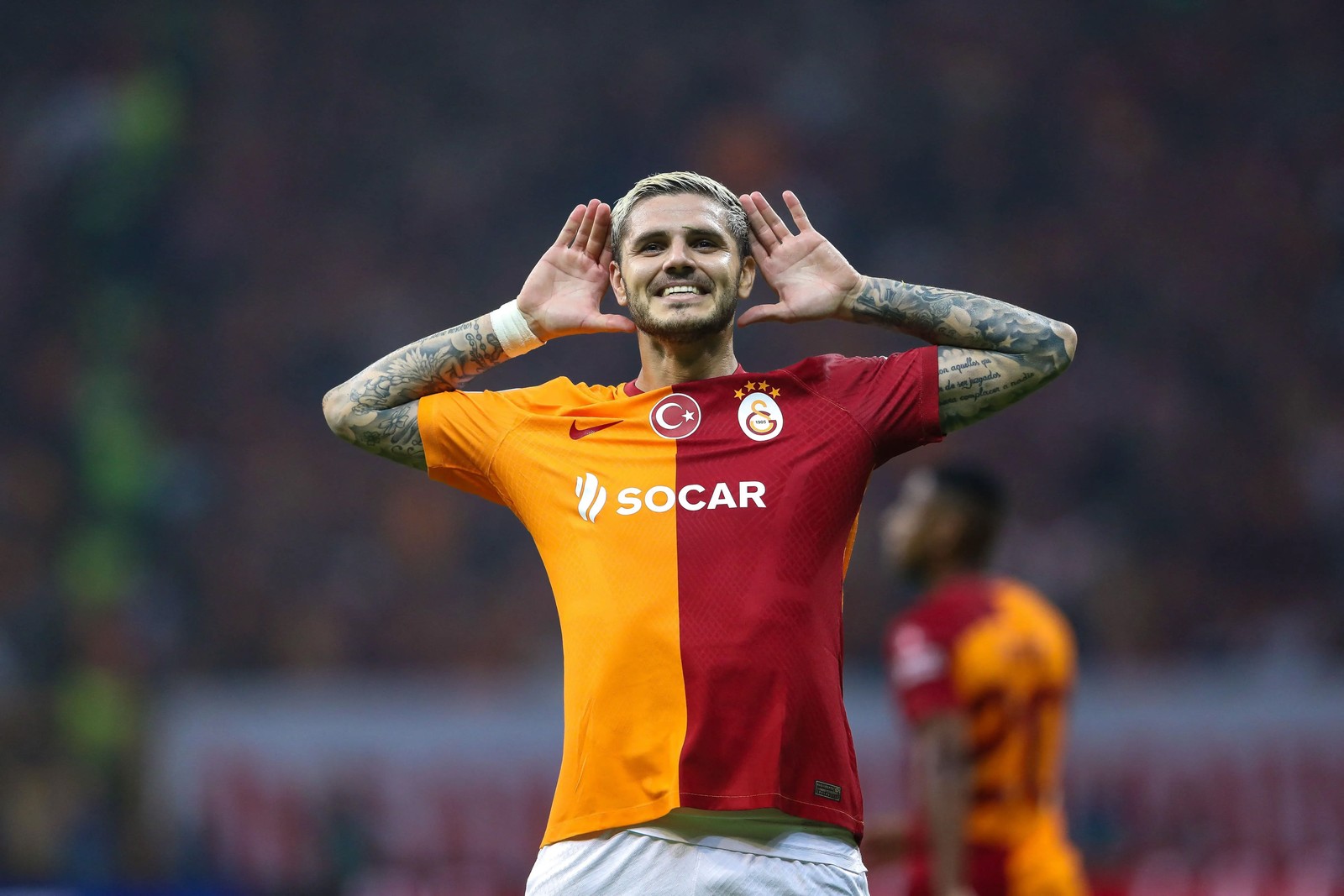 Arafed soccer player with tattoos on his arms and arms raised in the air (mauro icardi, galatasaray, turkish sports club, argentine footballer, 5k)