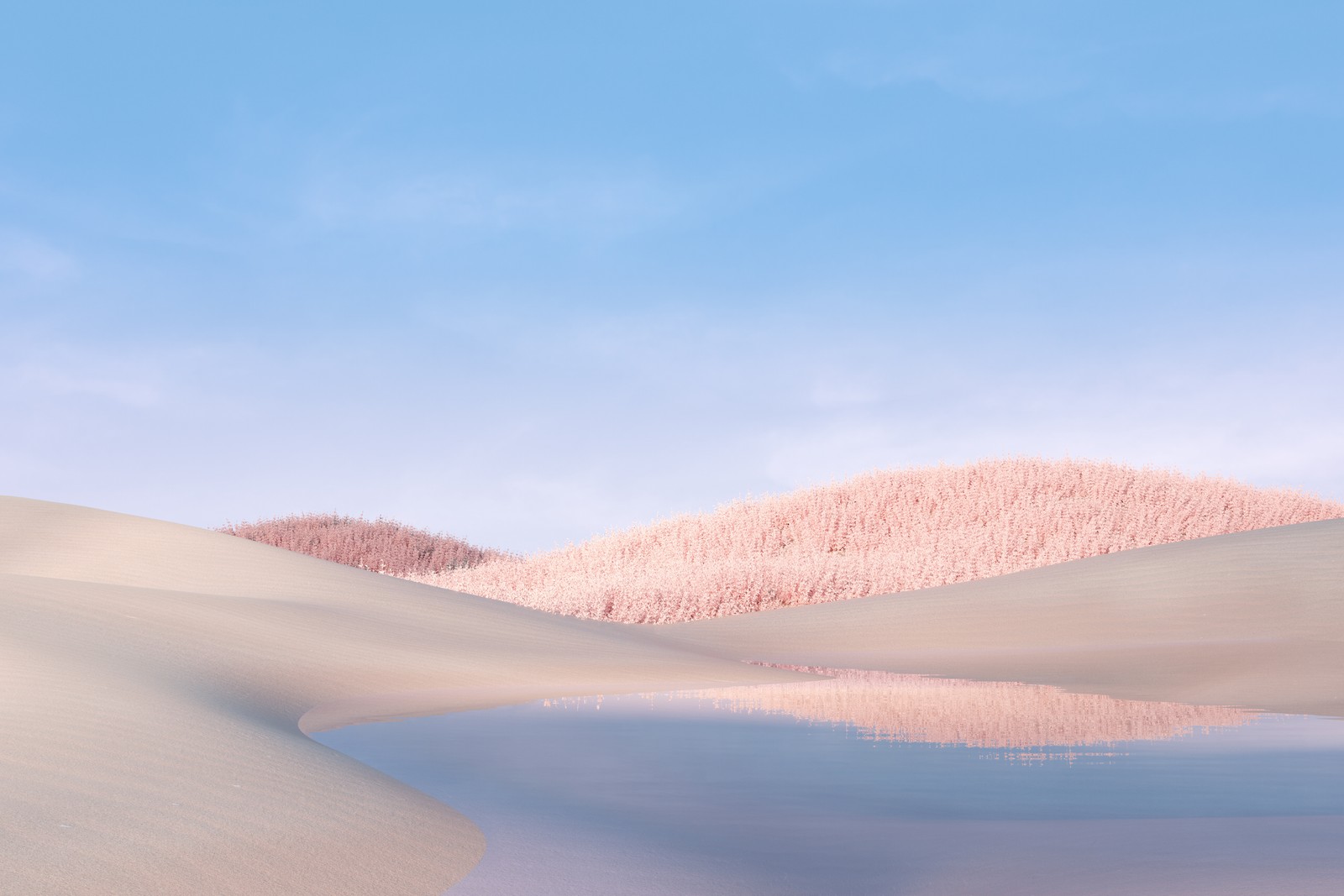 There is a picture of a desert with a mountain in the background (landscape, blue sky, microsoft surface laptop, stock, 5k)