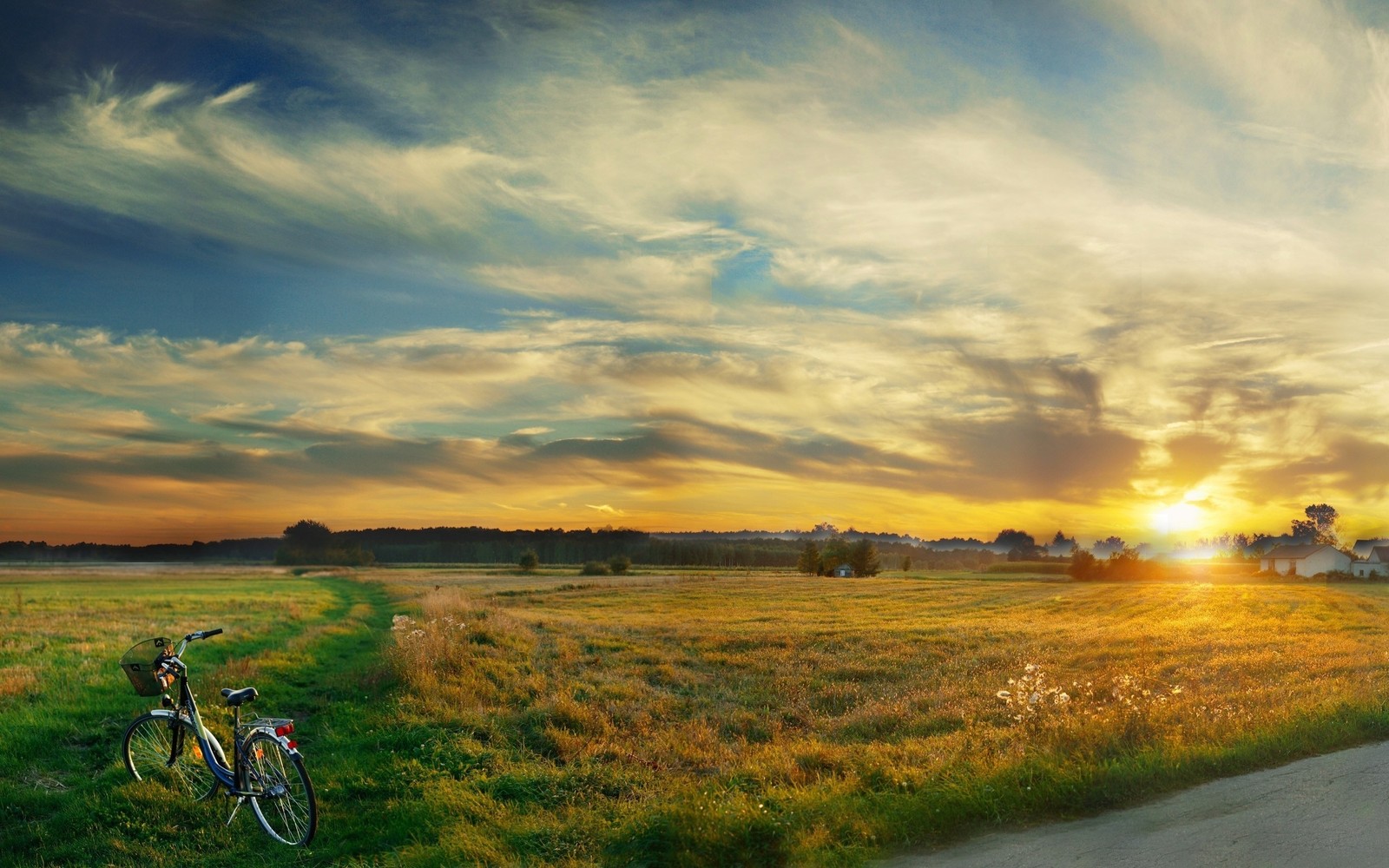 Arafed bike parked on the side of a road in a field (evening, silence, clouds, sky, bicycle)