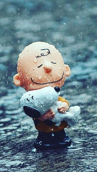 Charlie Brown étreignant Snoopy sous la pluie