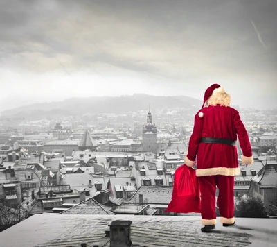 Santa Overlooks a Snowy Town on Christmas Eve