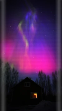 Enchanting Aurora Borealis Illuminating a Night Sky Above a Cozy Home