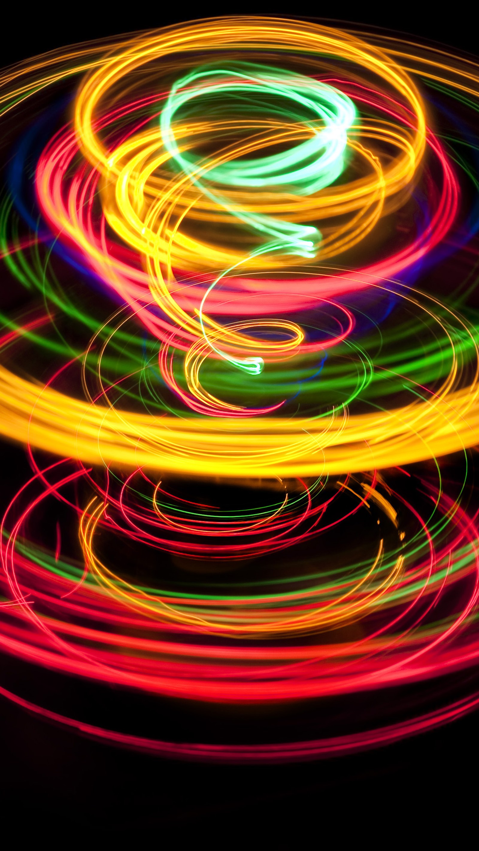 A close up of a colorful light painting of a circle (abstract, blue, circles, cool, gold)