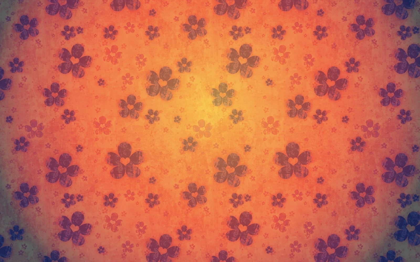 Un gros plan d'un fond coloré avec un motif de fleurs (texture, orange, jaune, motif)