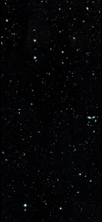 Cosmic Tapestry: A Midnight View of Distant Galaxies and Stars