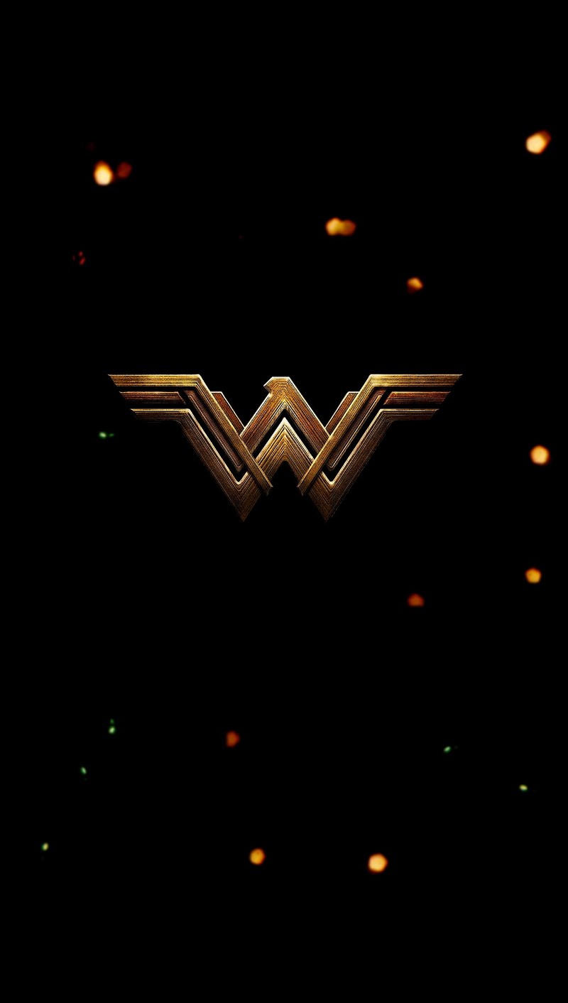 Крупный план логотипа на черном фоне с огнями (диана, diana, чудо женщина, wonder woman, вв)