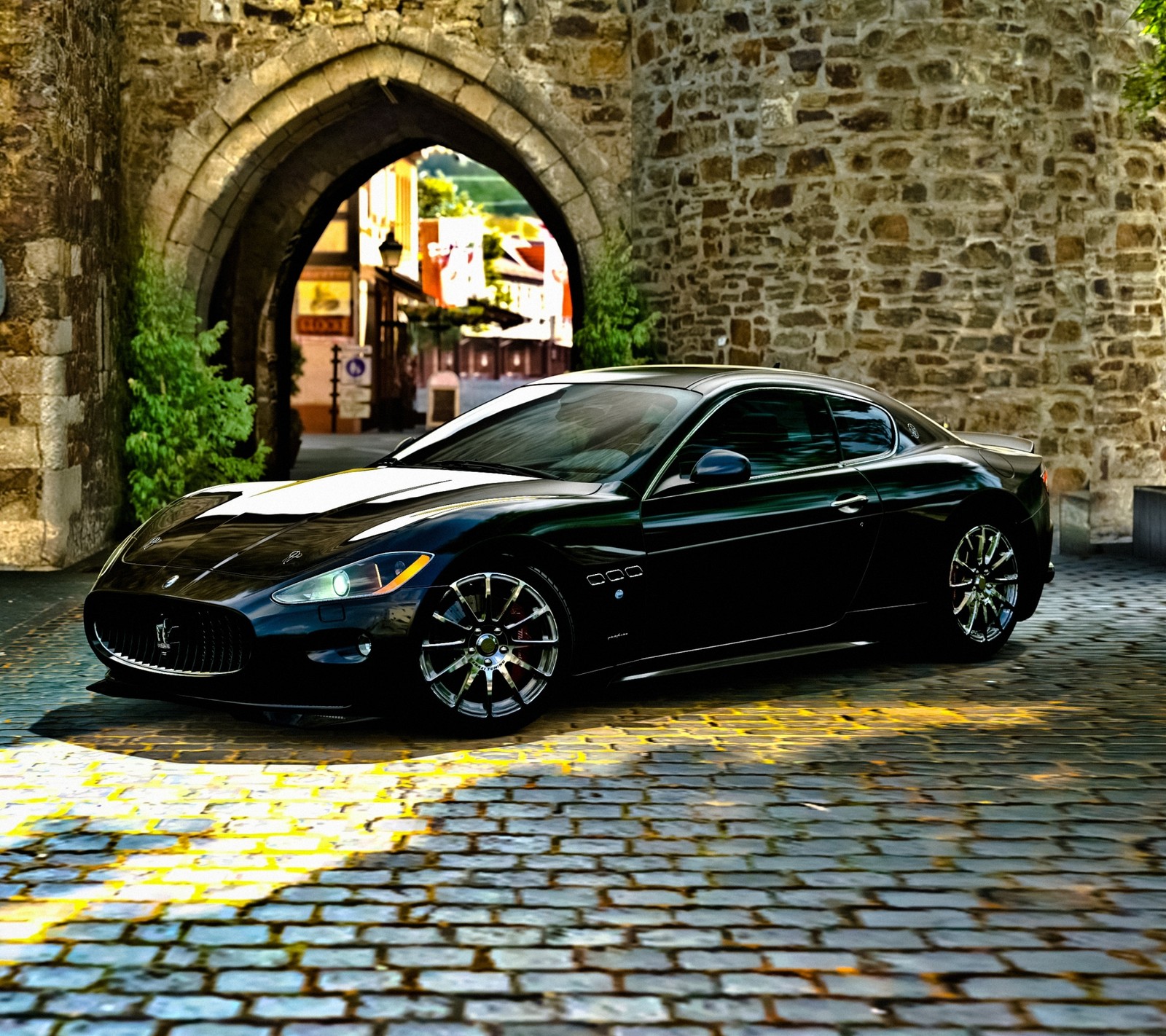 Arafed black sports car parked in front of a stone arch (black, car)