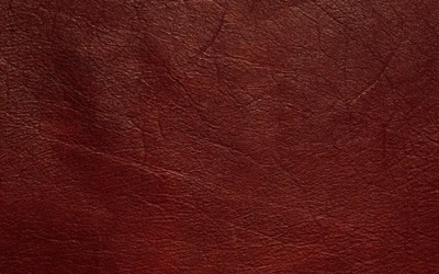 Rich maroon leather texture with subtle natural patterns.