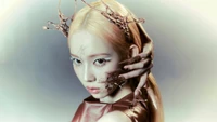 Kim Min Jeong of Aespa in a winter-themed, ethereal portrait with artistic elements.