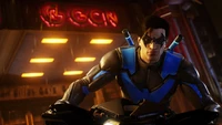 Nightwing on a motorcycle in Gotham, ready for action in Gotham Knights.