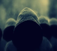 Mysterious figures shrouded in shadows and hoods, set against a backdrop of blurred rain.