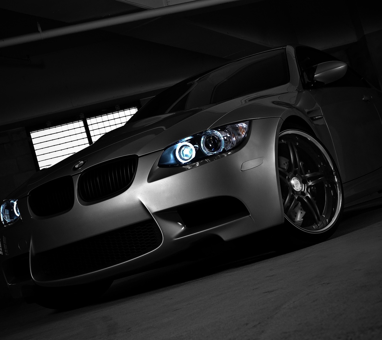 Arafed view of a car in a garage with a light on (auto, bimmer, bmw, car, m3)