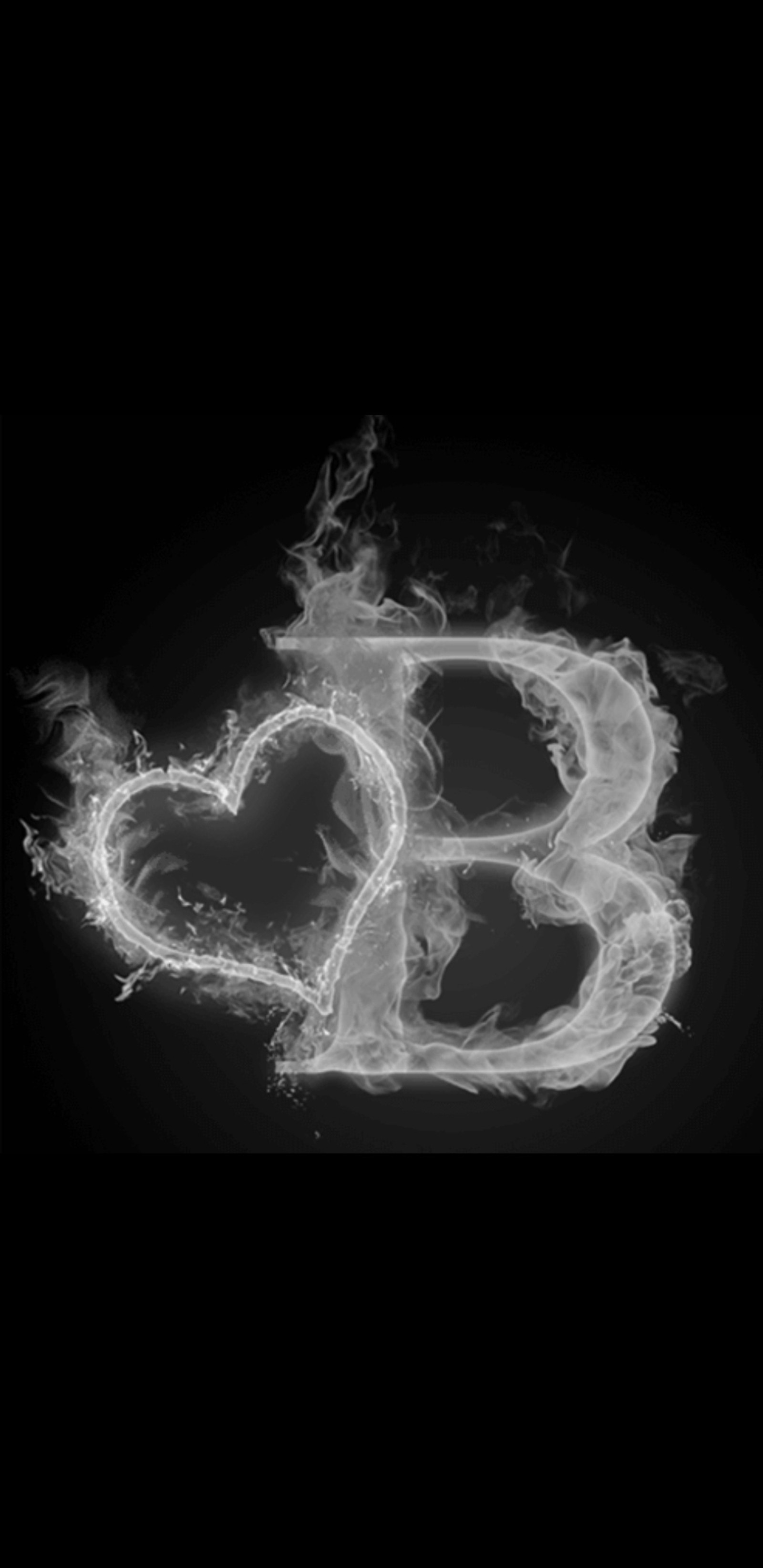 A black and white photo of a heart made of smoke (smoke, letter, letters, alphabets, black)