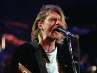 Kurt Cobain se apresentando apaixonadamente no palco, incorporando o espírito da música grunge.