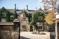 Charming Medieval-Style Estate with Lush Ivy and Elegant Entrance