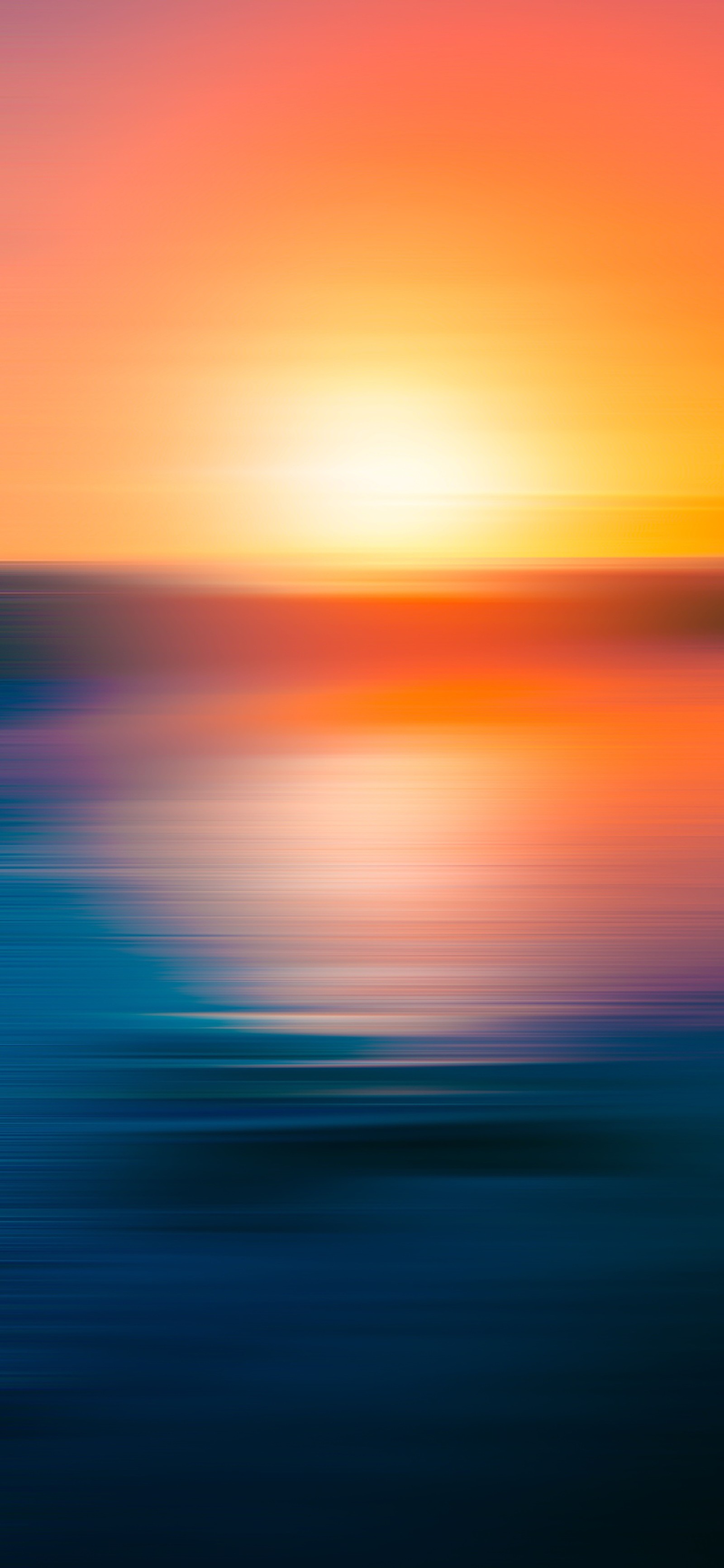 Blurred image of a sunset over a body of water (horizon, sunset, greece, golden hour, water)