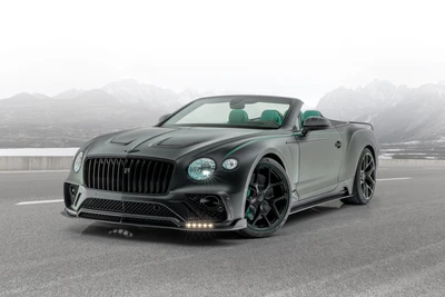 Mansory Bentley Continental GT V8 Кабриолет в элегантном черном цвете с зелеными акцентами на горной дороге