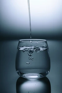 Refreshing Water Being Poured into a Glass