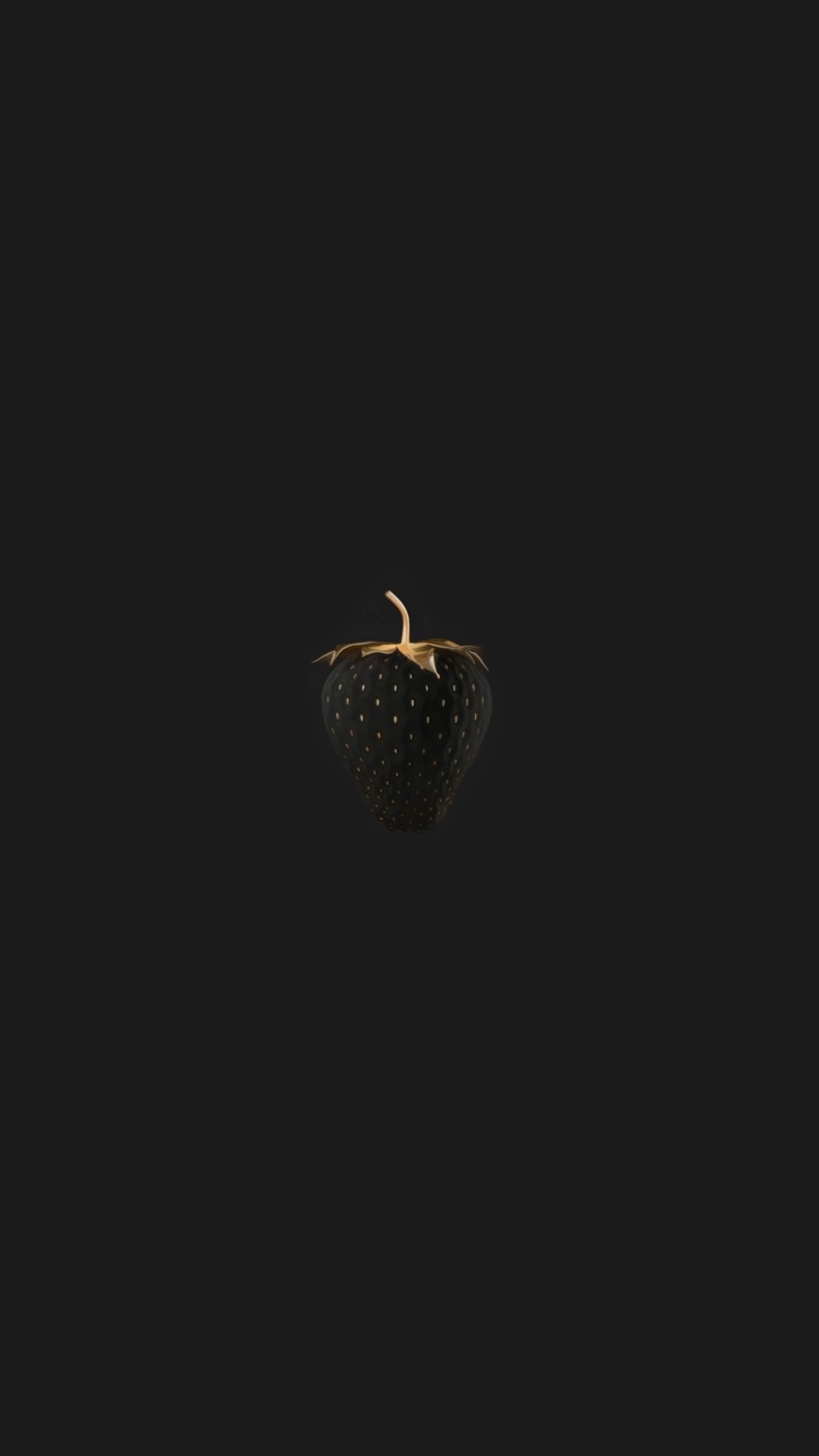 There is a black apple with a gold leaf on it (black, black strawberry, strawberry)