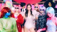 Kwon Yu Ri shines at Cosmic Festa, surrounded by a vibrant ensemble of colorful characters in a futuristic, playful setting, celebrating the essence of K-pop and Girls' Generation's 7th album, "Forever 1.