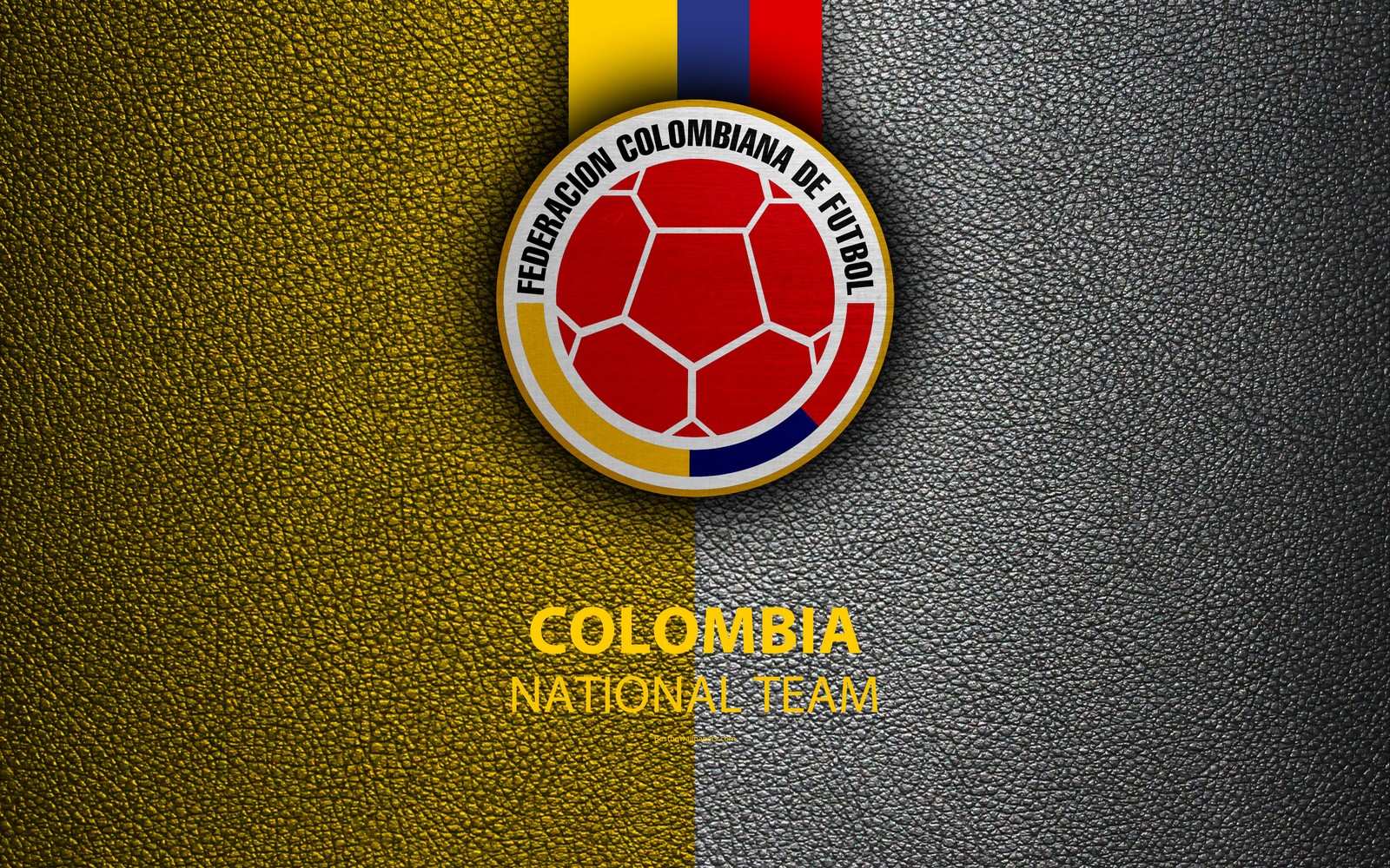 A close up of a soccer ball with a ribbon around it (colombia, emblem, football, logo, national)