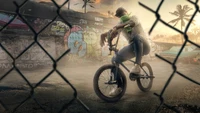 Freestyle BMX Fahrer in urbaner Graffiti-Umgebung