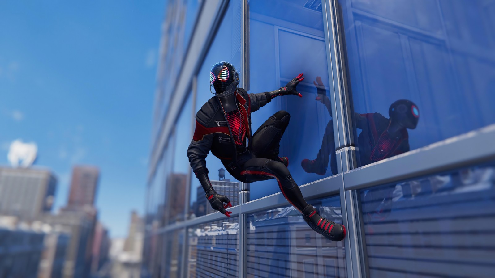 Spider-man en un costume noir est suspendu à un bâtiment (marvels spider man miles morales, playstation 5, ps5, ps4, jeu vidéo)