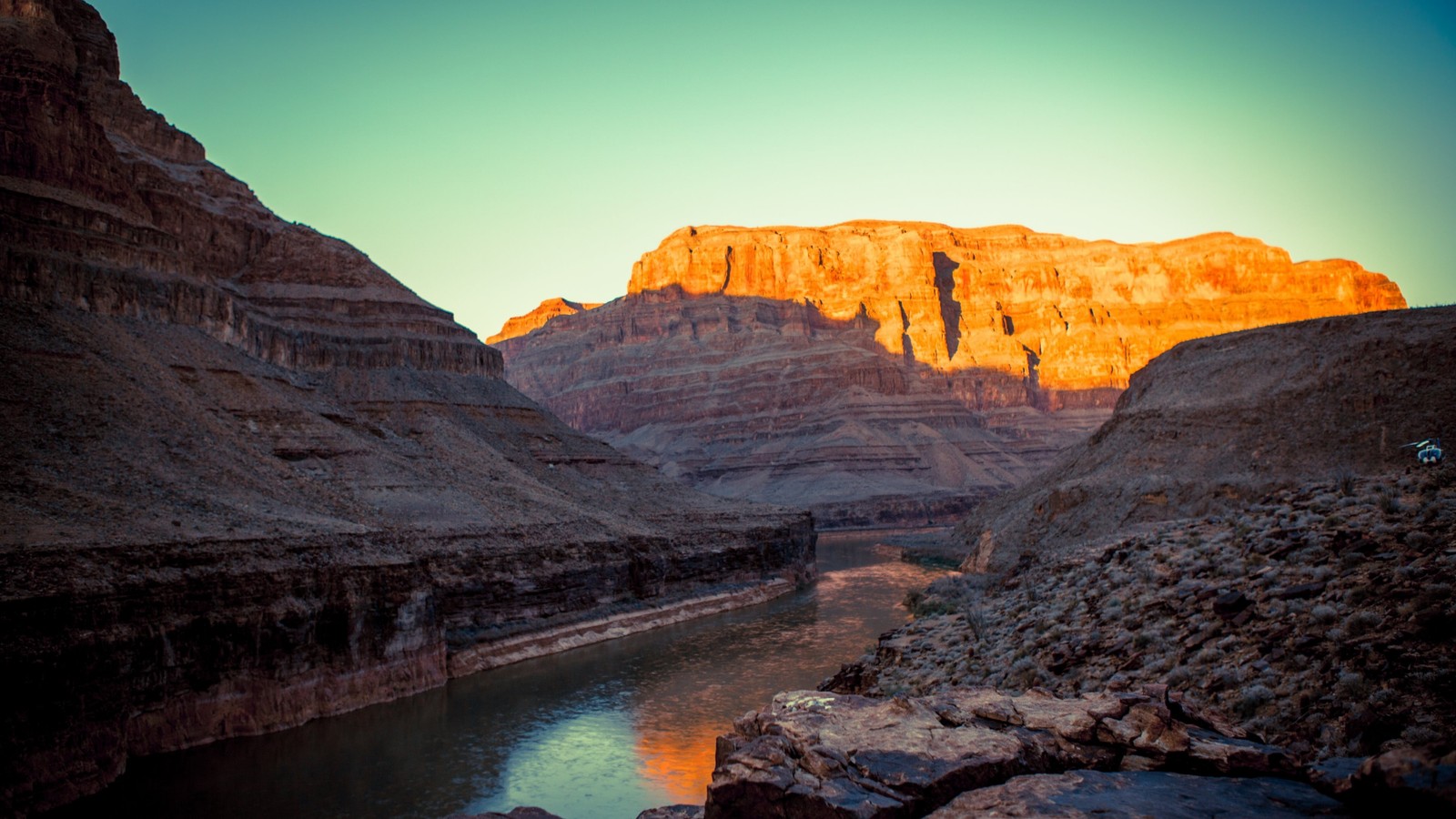 A view of a river running through a canyon next to a mountain (grand canyon village, bryce canyon national park, national park, badlands, wadi)