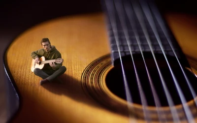 Musician Playing Acoustic Guitar from Within the Instrument