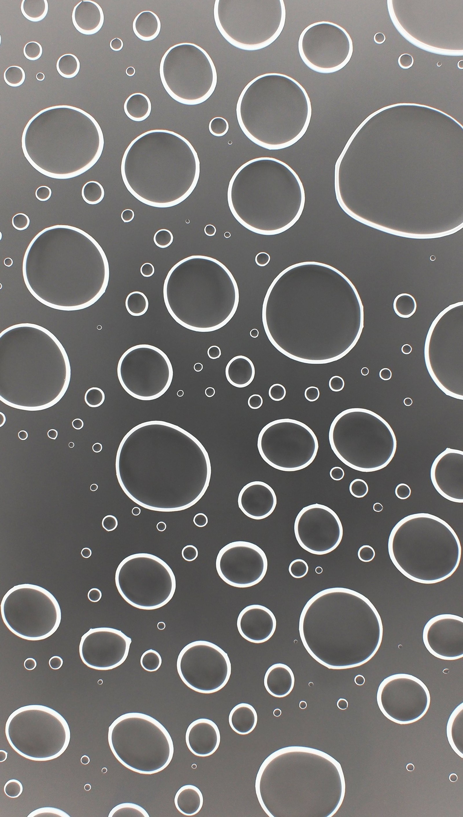 A close up of a bunch of bubbles floating in a pool (abstract, art, circle, water)