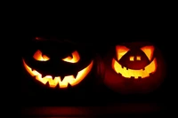 Spooky Jack-o'-Lanterns Illuminated Against a Dark Background