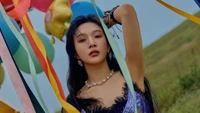 Joy from Red Velvet Radiates Elegance Amidst Colorful Balloons