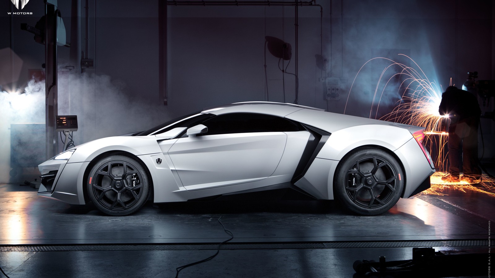 A white sports car is parked in a garage with sparks (audi r8, cars, sports car, audi quattro, audi)