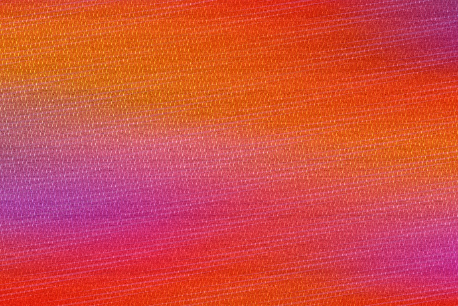 A close up of a colorful background with a blurry pattern (orange, red, purple, magenta, creativity)