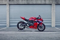 2024 Honda CBR650R: Sleek Red Sports Touring Bike in Urban Setting