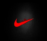 Logotipo rojo de Nike sobre un fondo negro de panal