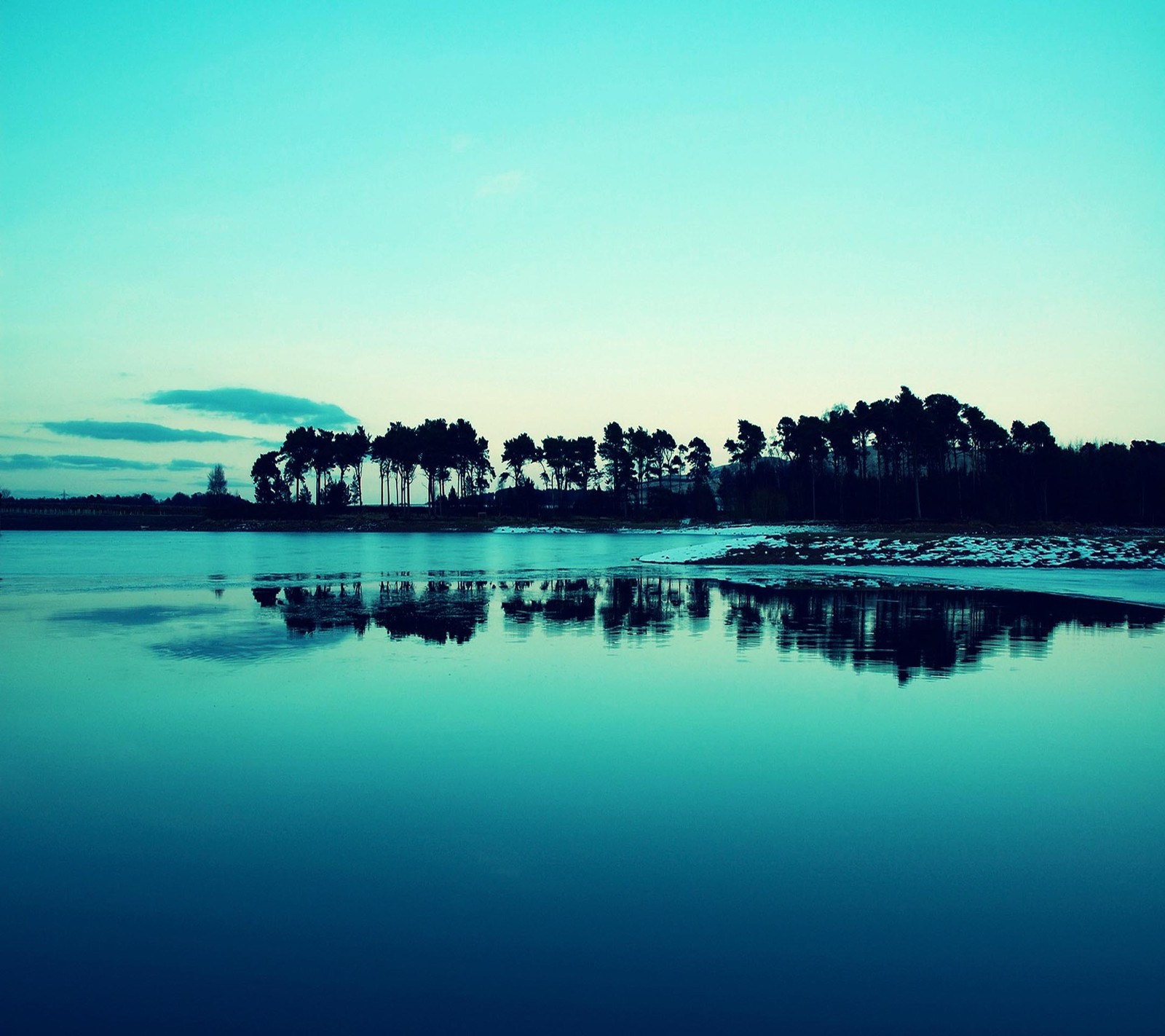 There is a blue sky with a few clouds over a lake (beautiful, cute, look, nice)