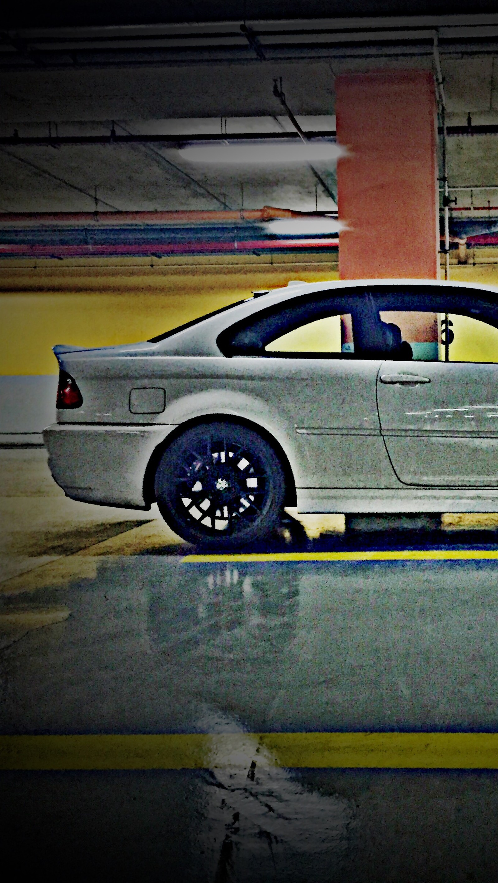 There is a silver car parked in a parking garage (19, alpine, bmw, e46, gts)