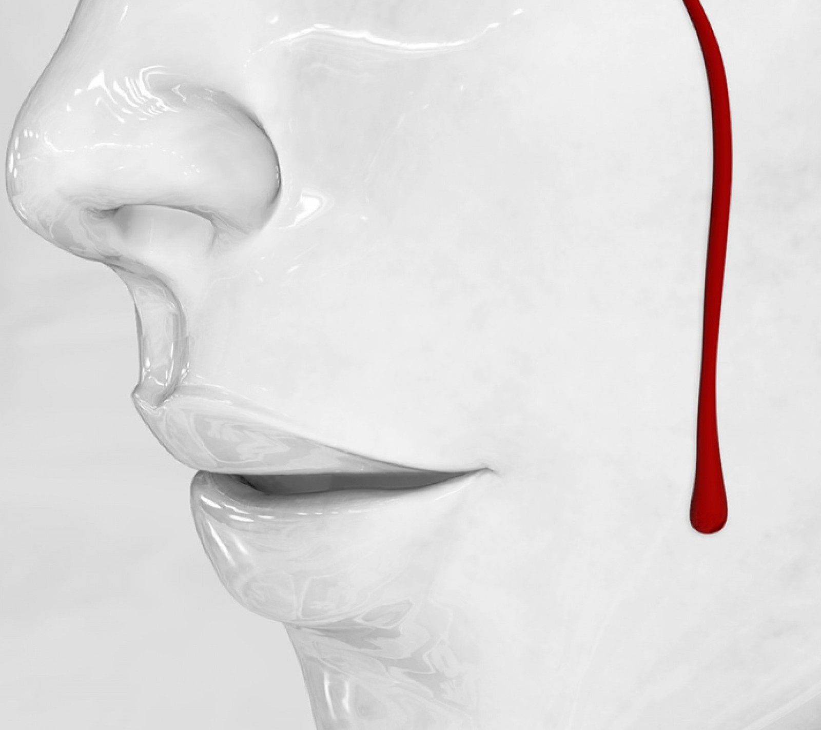 There is a white sculpture with a red drip on it (blood, tears)