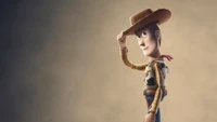 Woody de Toy Story 4, enlevant son chapeau dans une pose classique de cowboy.