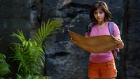 Dora segurando um mapa do tesouro na selva