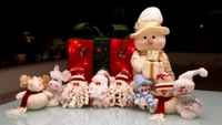 Festive Holiday Decor: Snowmen and Santa Figures Surrounded by a Gift Box