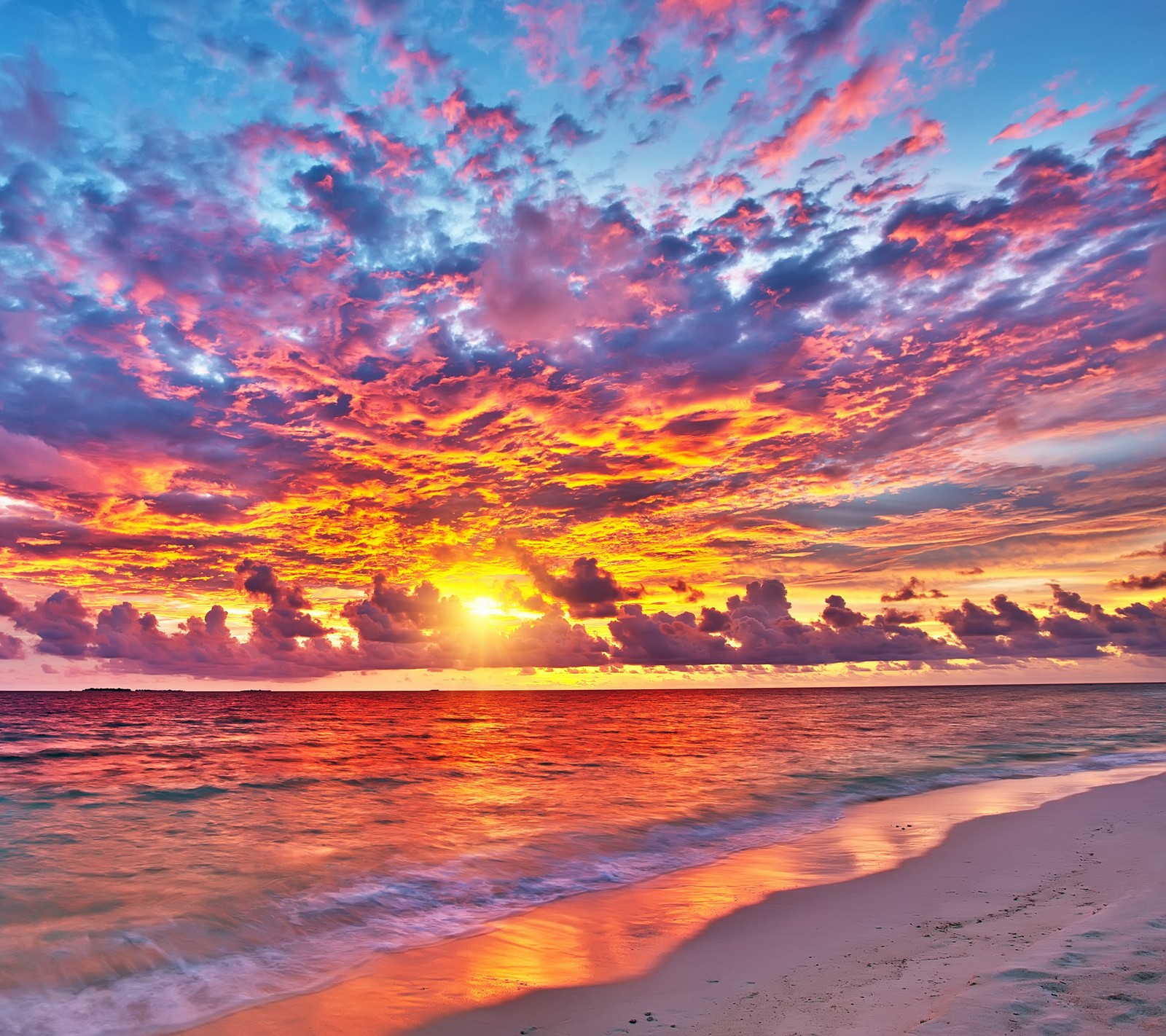 A view of a beach with a sunset and a body of water (beach, nature, sand, sunset, water)