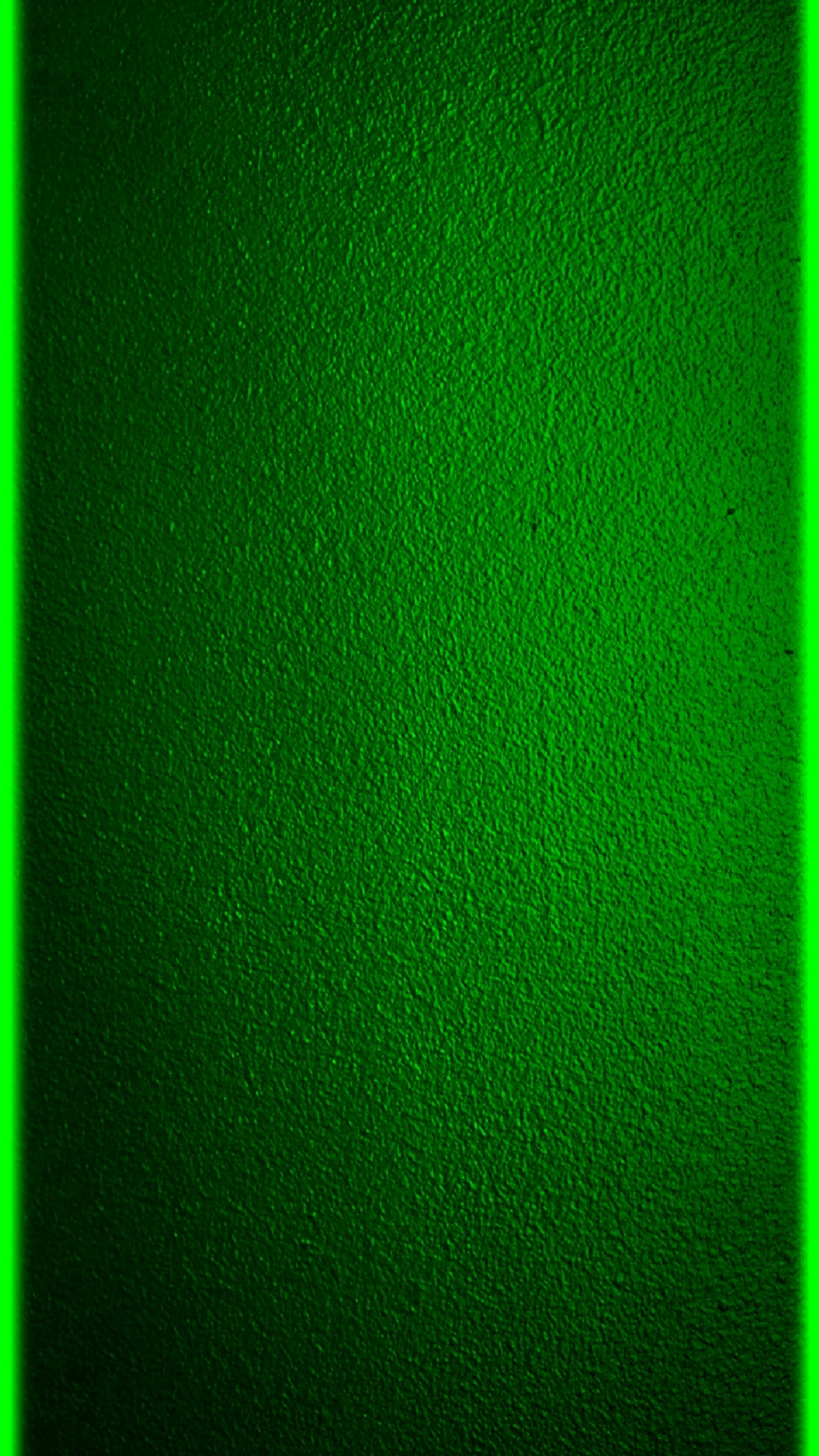 Un primer plano de un marco de neón verde en una pared (borde, verde, textura)