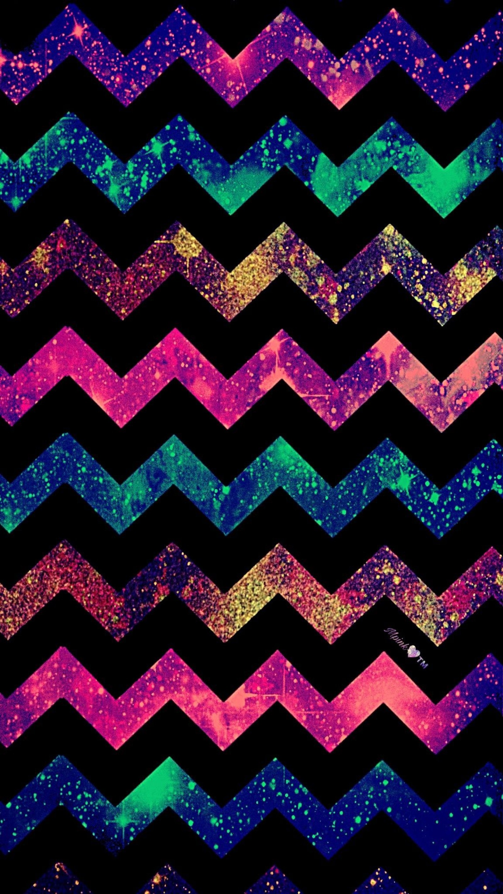 A close up of a chevron shaped pattern with a black background (zig, zag, rainbow, glitter, black)