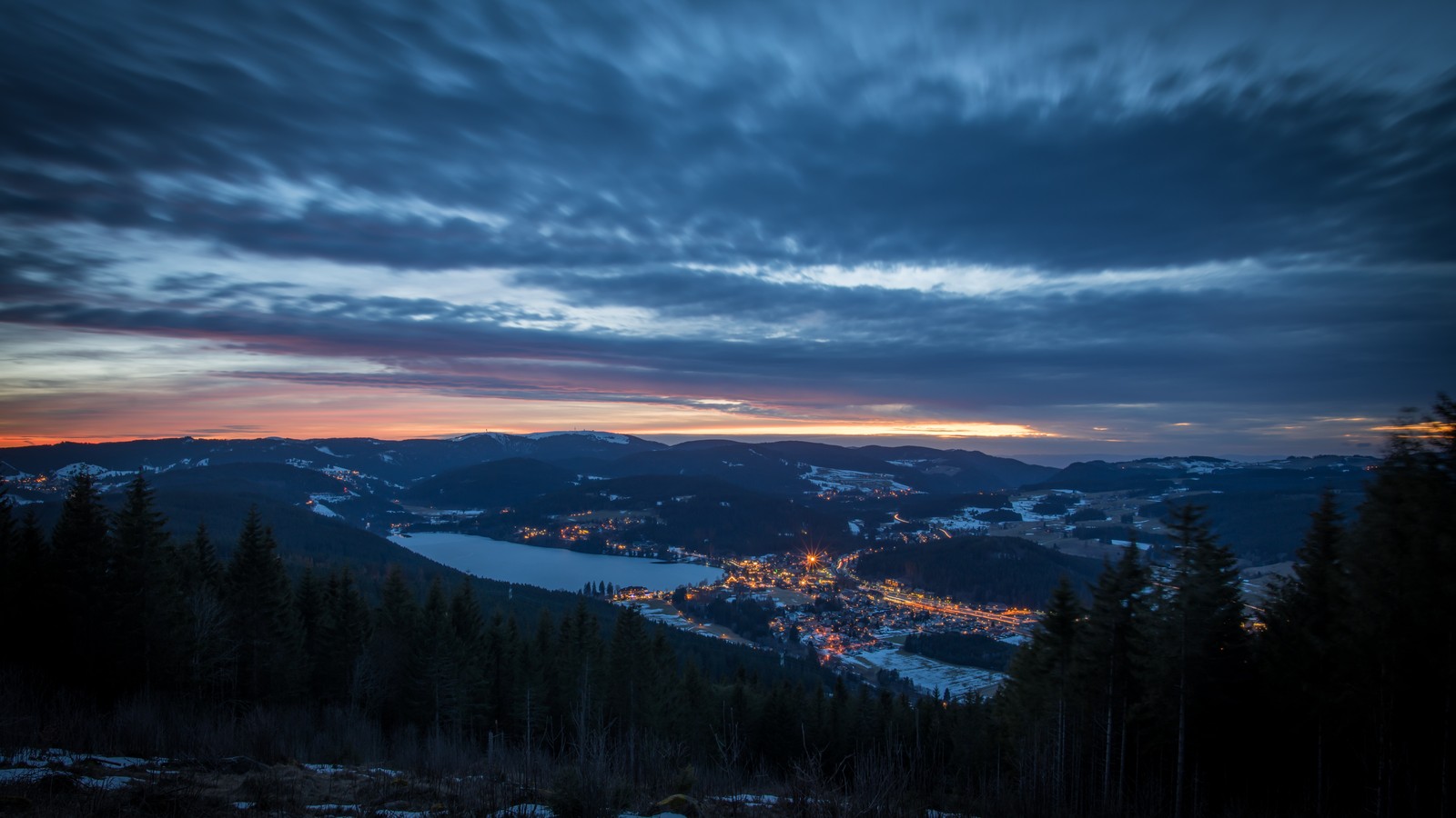 A view of a mountain with a lake and a forest at dusk (cloud, nature, mountain, blue, winter)